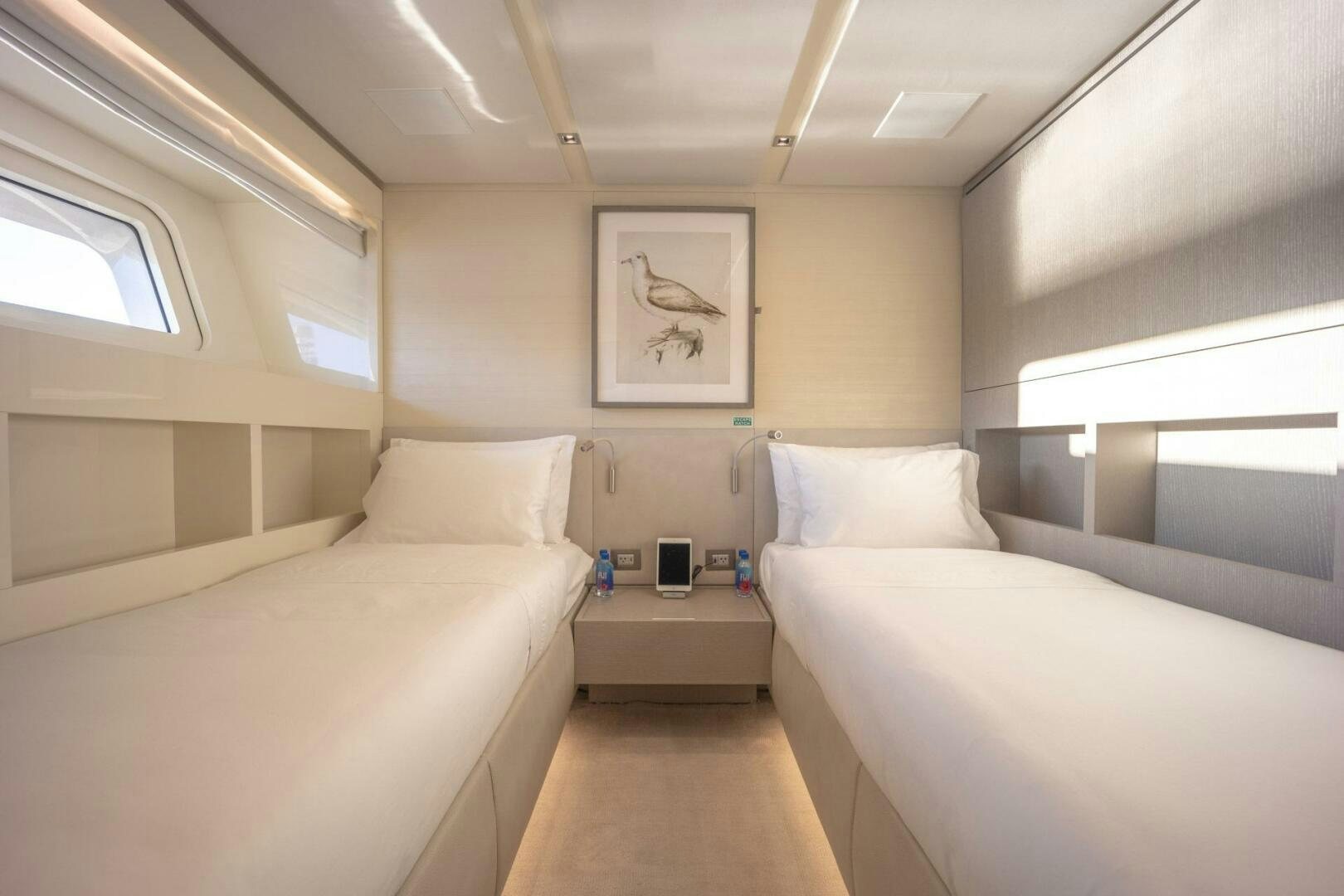 a room with two beds aboard PHOENIX Yacht for Sale