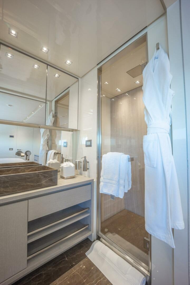 a bathroom with a shower and sink aboard PHOENIX Yacht for Sale