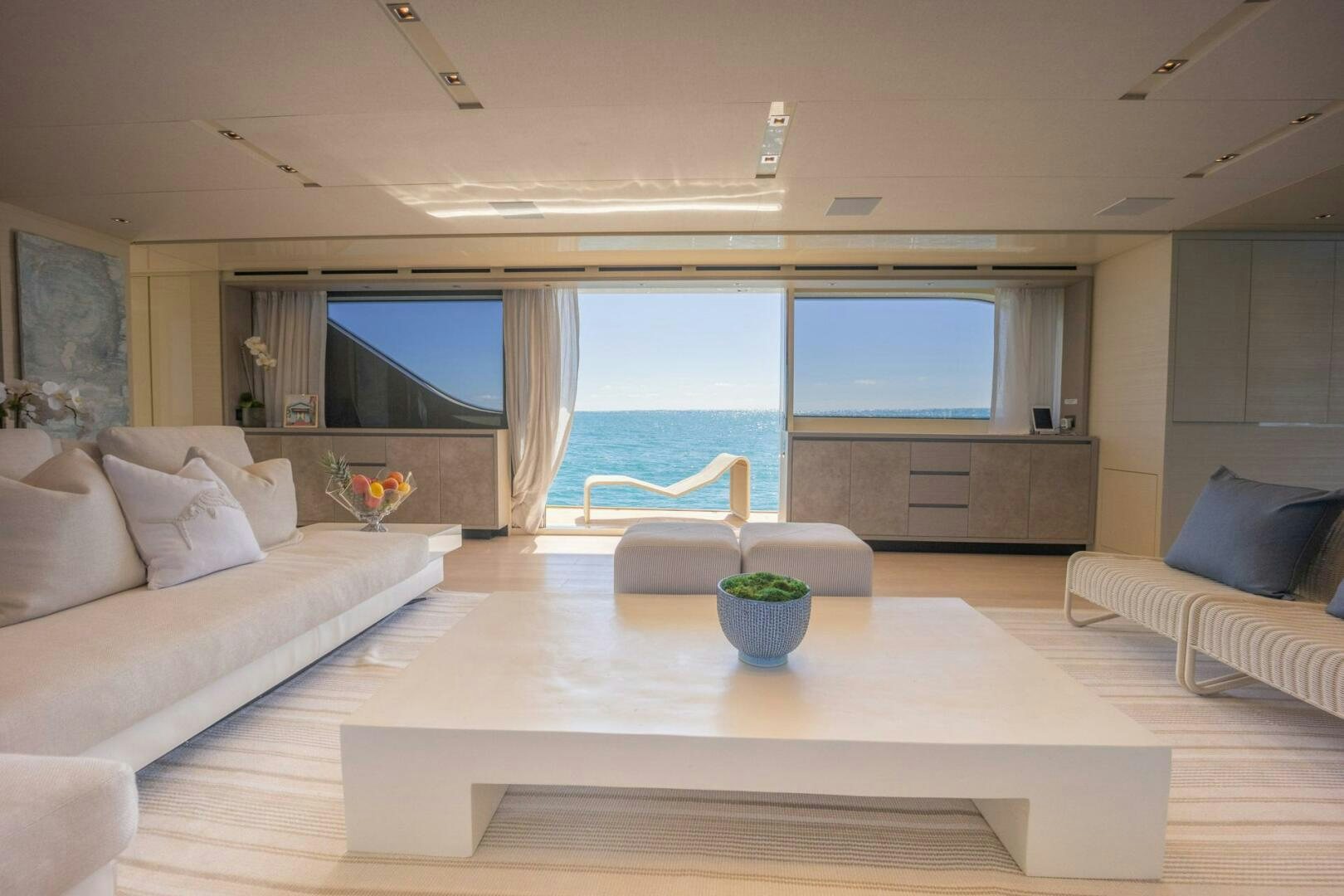 a living room with a large window aboard PHOENIX Yacht for Sale