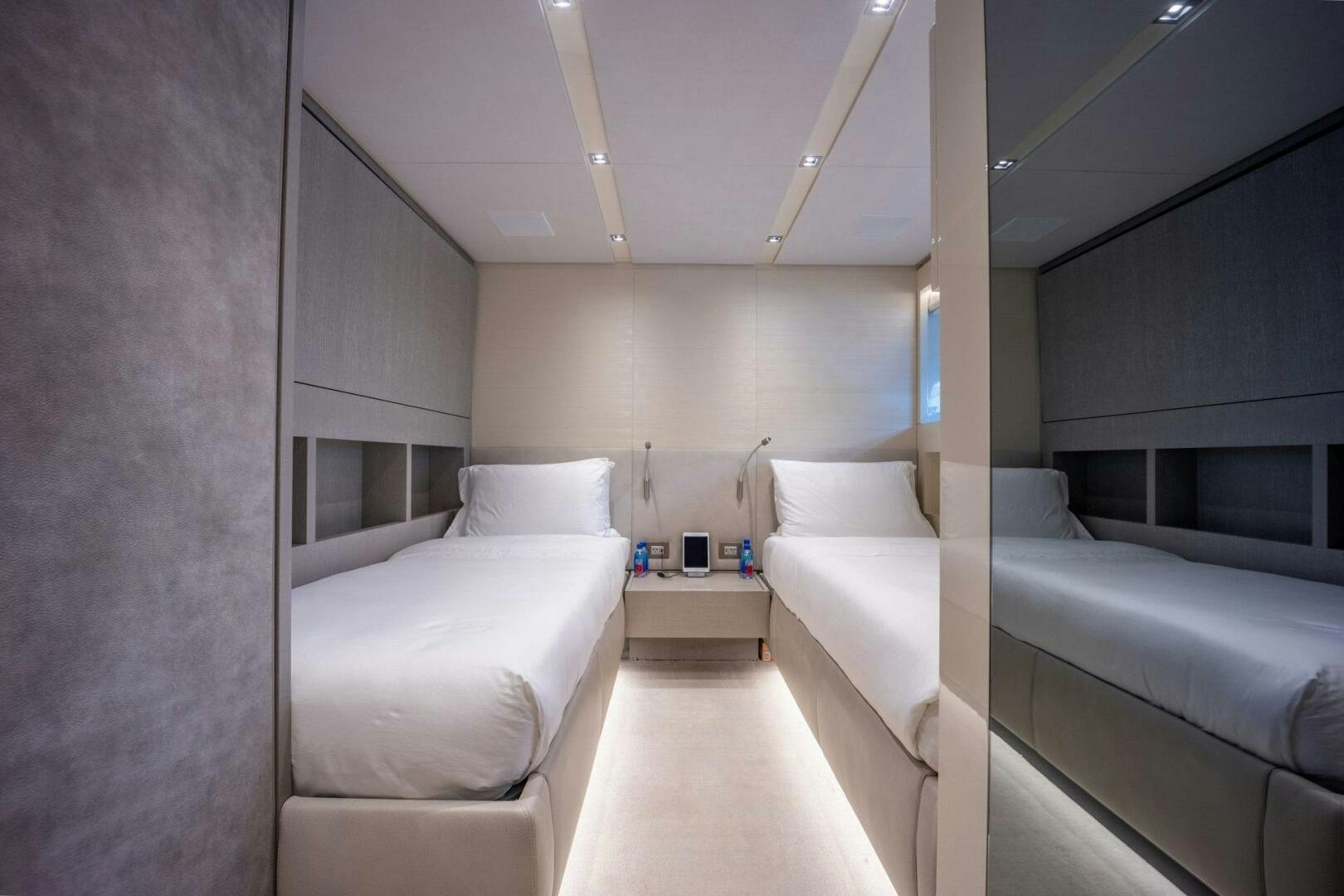 a room with a bed and a couch aboard PHOENIX Yacht for Sale