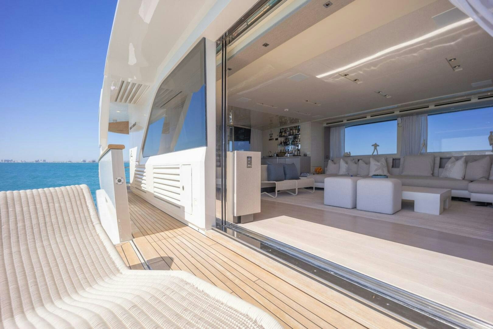 a room with a view of the ocean and the deck aboard PHOENIX Yacht for Sale