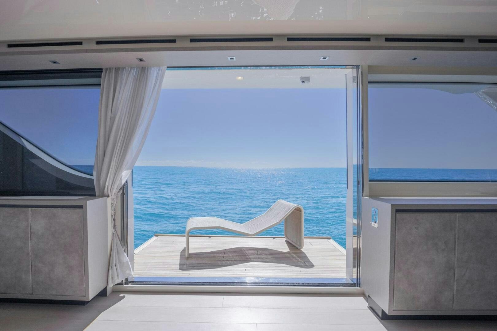 a chair on a deck aboard PHOENIX Yacht for Sale