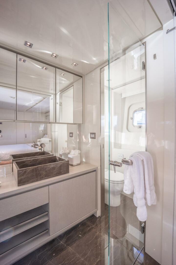 a bathroom with a glass shower aboard PHOENIX Yacht for Sale
