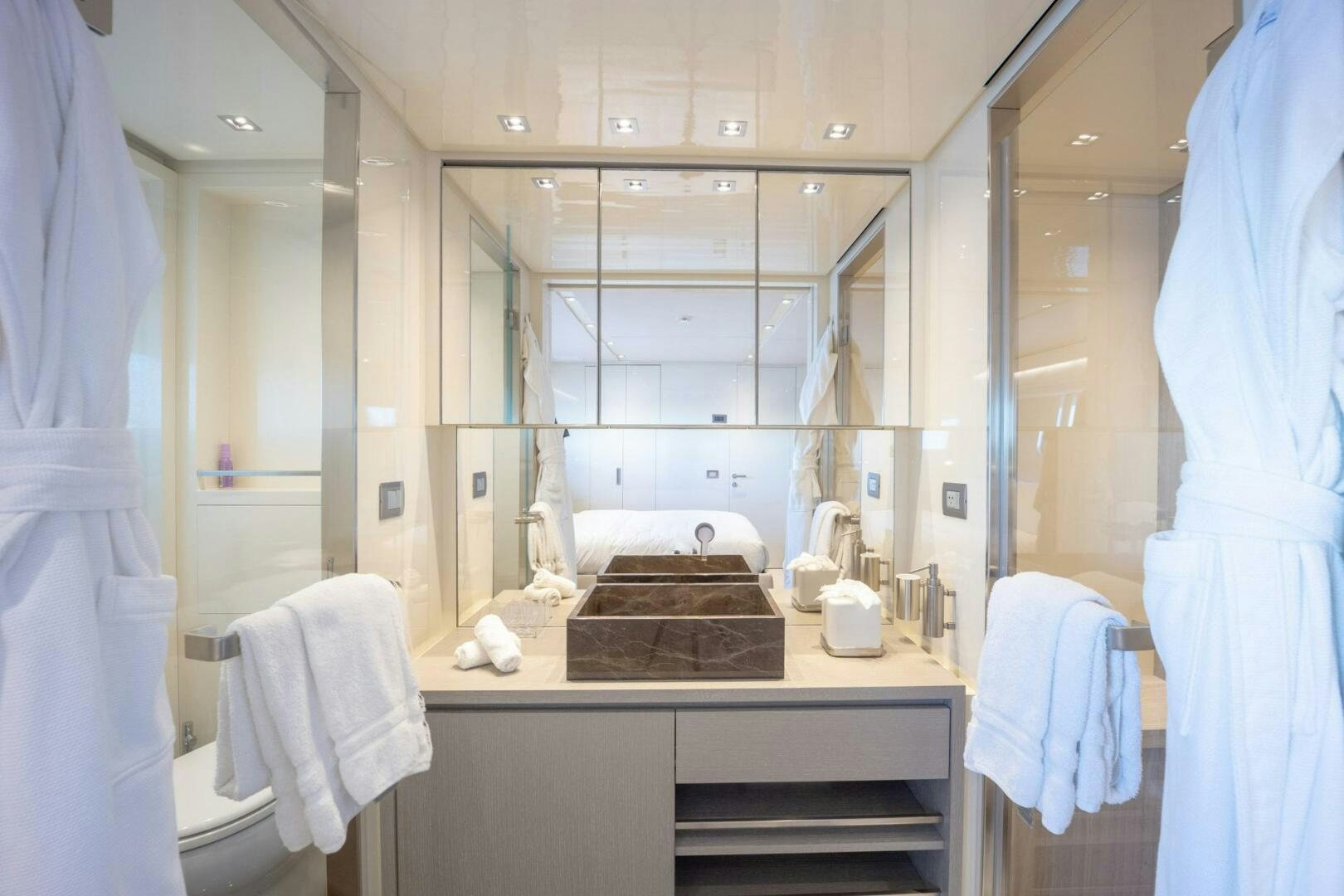 a bathroom with a sink and a mirror aboard PHOENIX Yacht for Sale