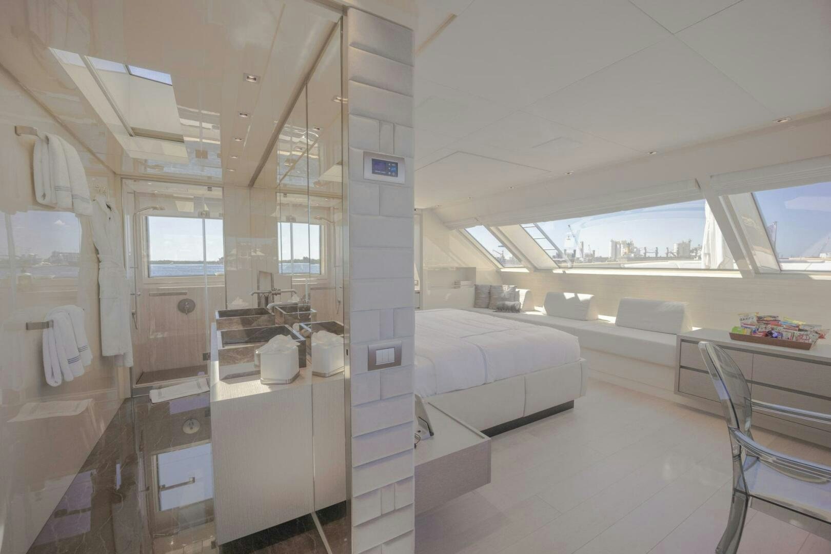 a room with a bed and a desk aboard PHOENIX Yacht for Sale