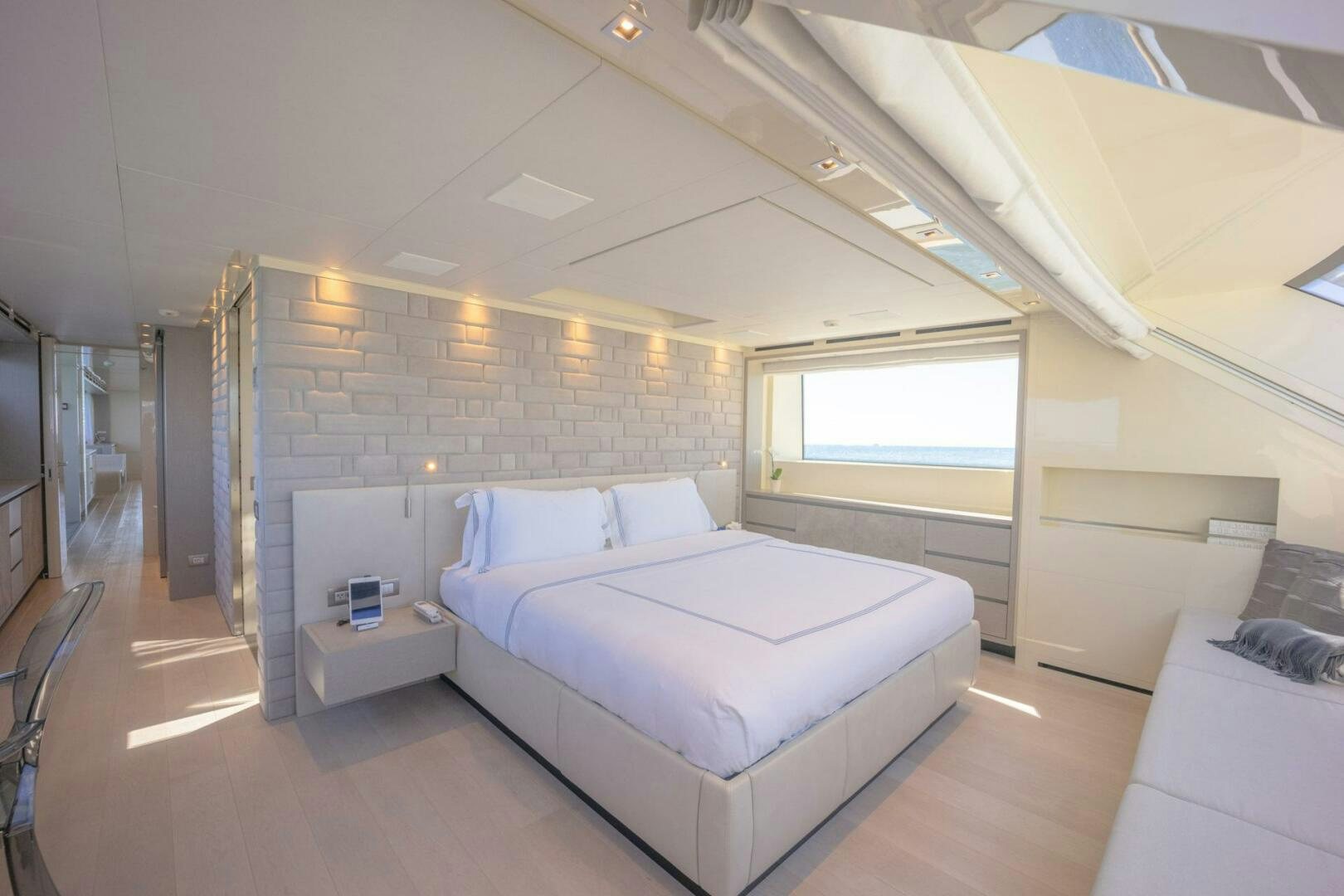 a room with a bed and a window aboard PHOENIX Yacht for Sale