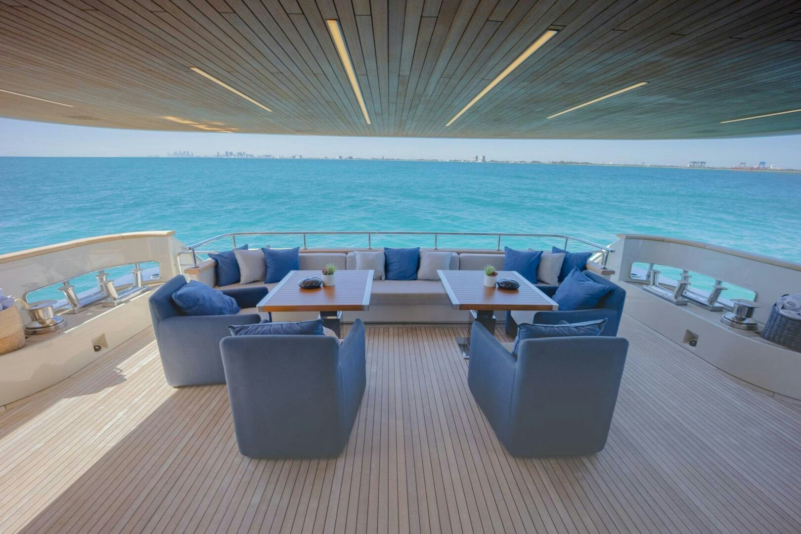 a room with a couch and a table and chairs aboard PHOENIX Yacht for Sale