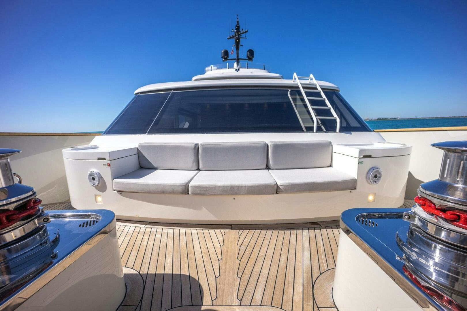 a white boat on a deck aboard PHOENIX Yacht for Sale