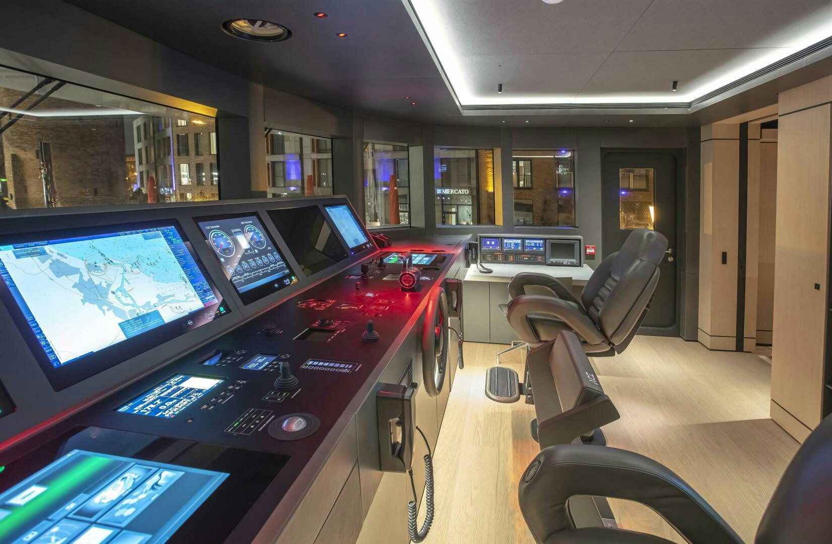 a room with computers and chairs aboard CONRAD C144S HULL 4 Yacht for Sale