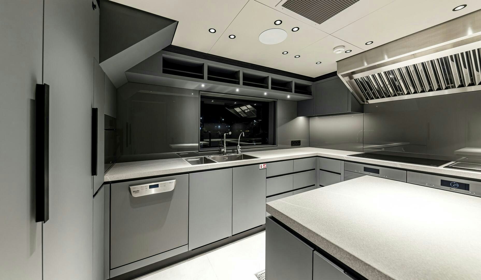 a kitchen with white cabinets aboard CONRAD C144S HULL 4 Yacht for Sale