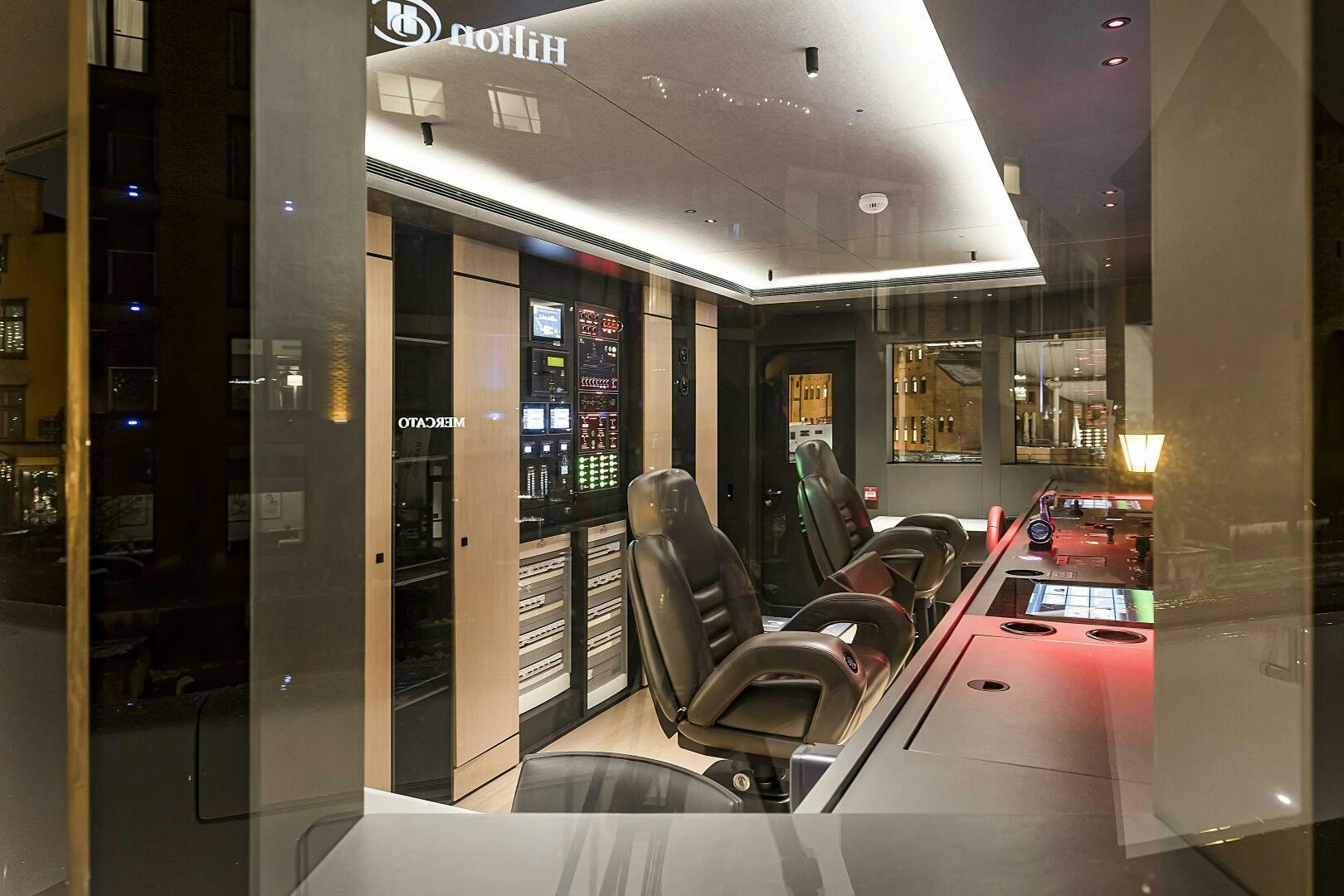 a room with a chair and a table aboard CONRAD C144S HULL 4 Yacht for Sale