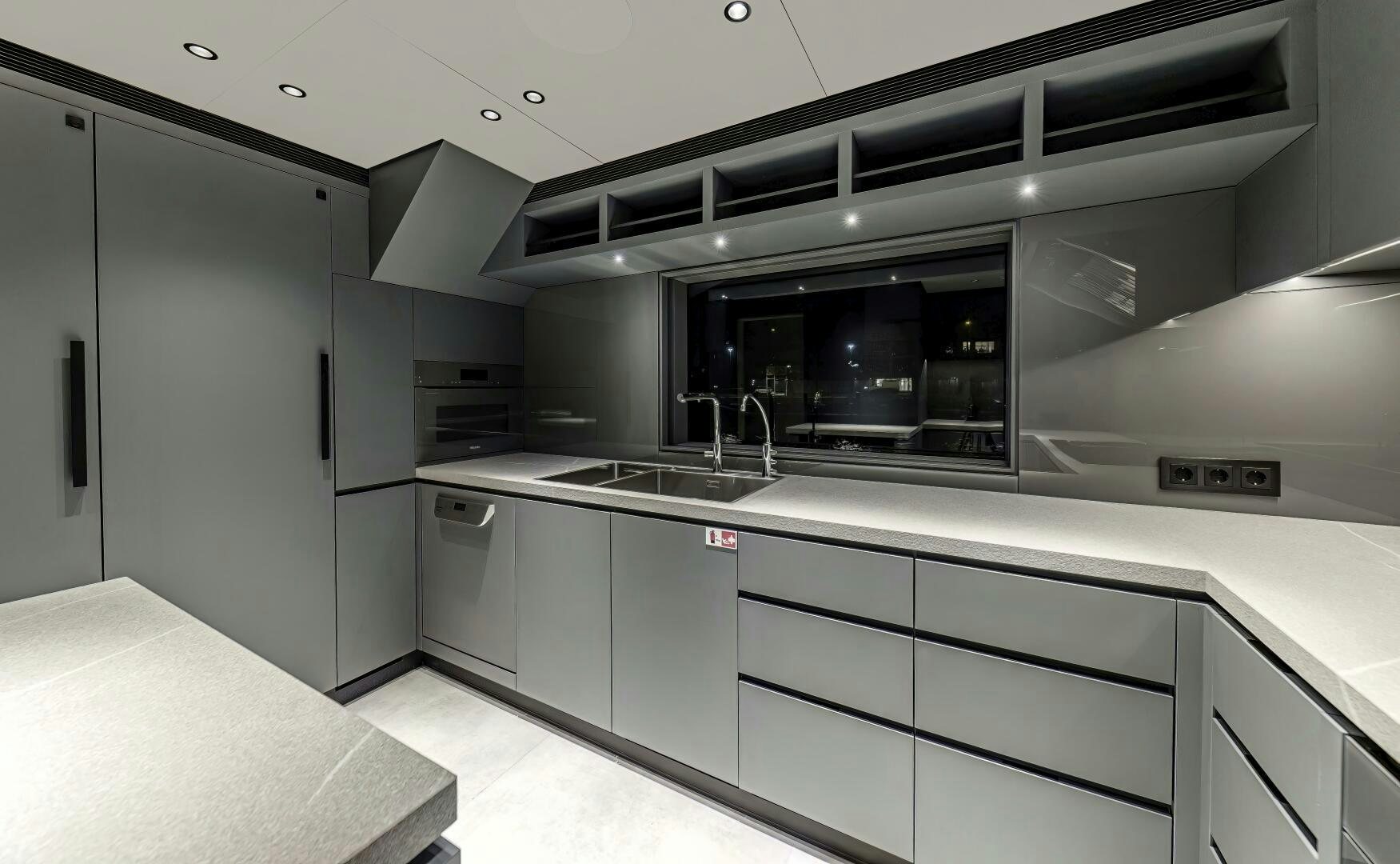 a kitchen with white cabinets aboard CONRAD C144S HULL 4 Yacht for Sale