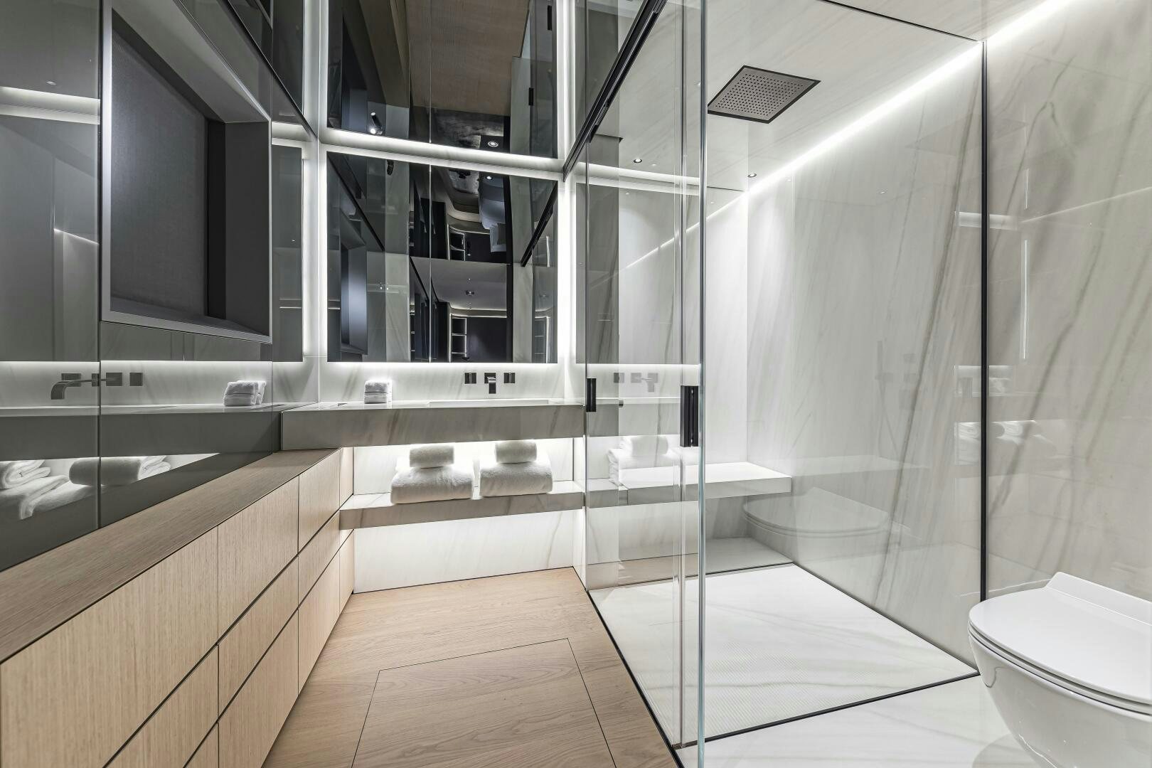 a bathroom with a glass shower aboard CONRAD C144S HULL 4 Yacht for Sale