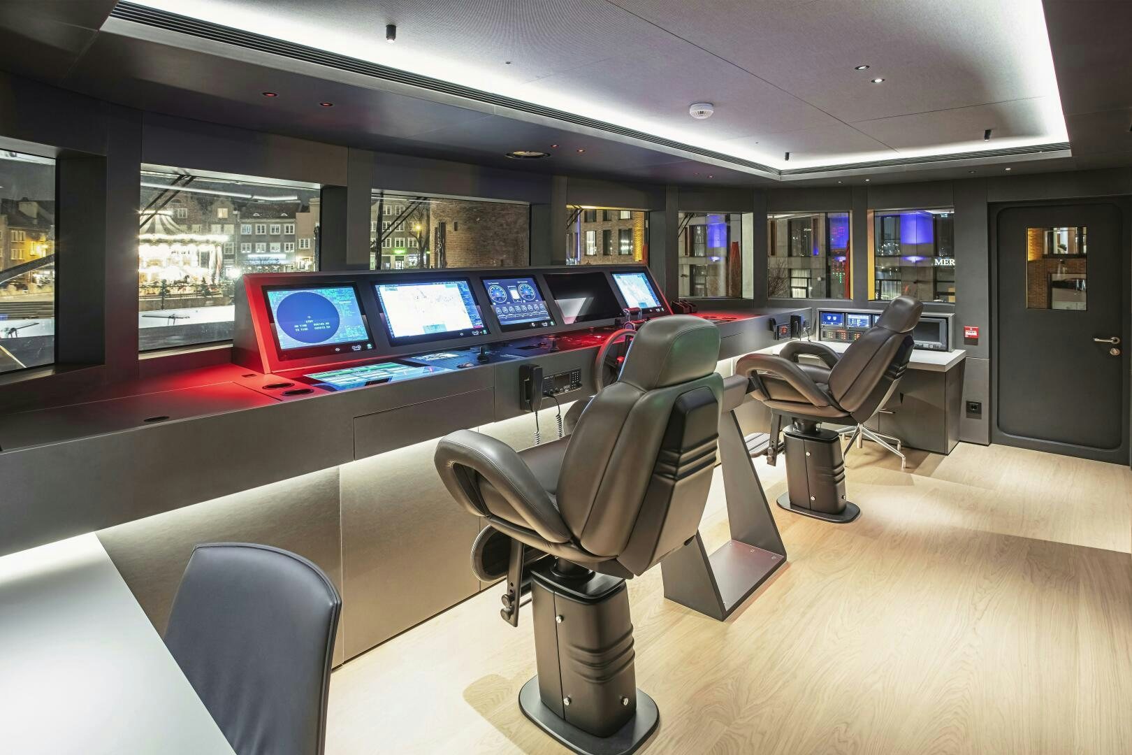 a room with a chair and desks and computers aboard CONRAD C144S HULL 4 Yacht for Sale