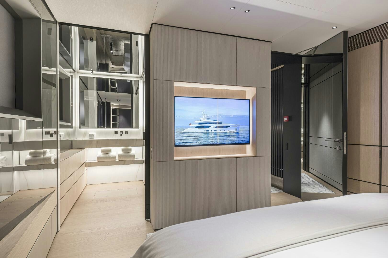 a room with a bed and a tv aboard CONRAD C144S HULL 4 Yacht for Sale