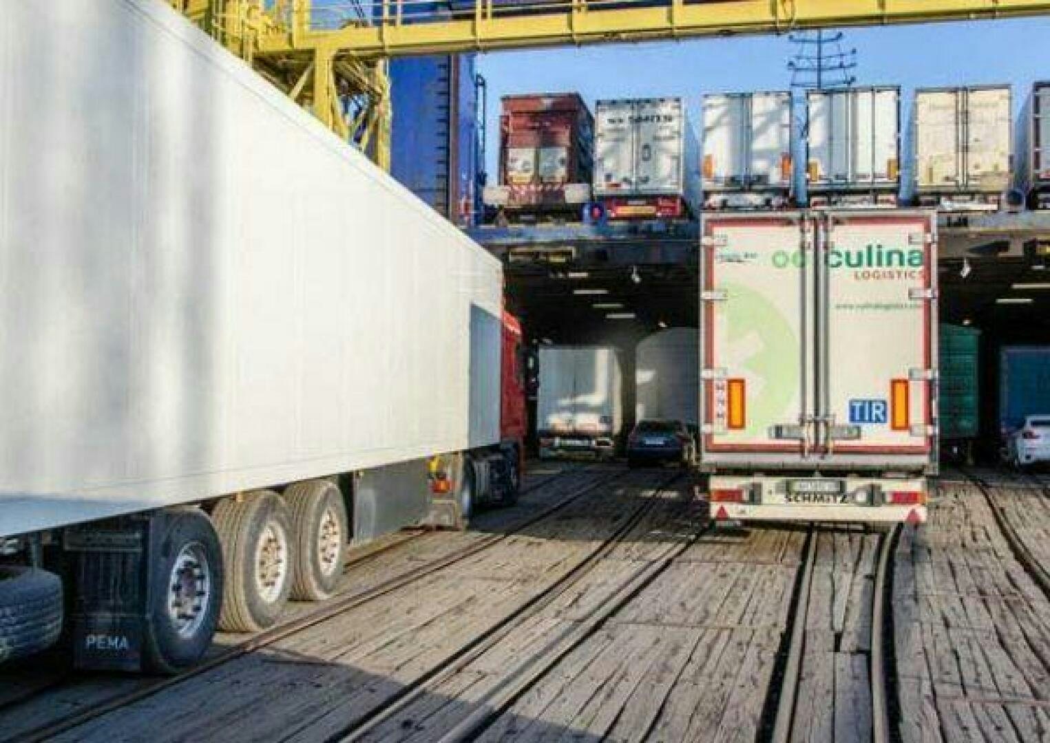 a large truck with a large trailer aboard KAUNAS Yacht for Sale