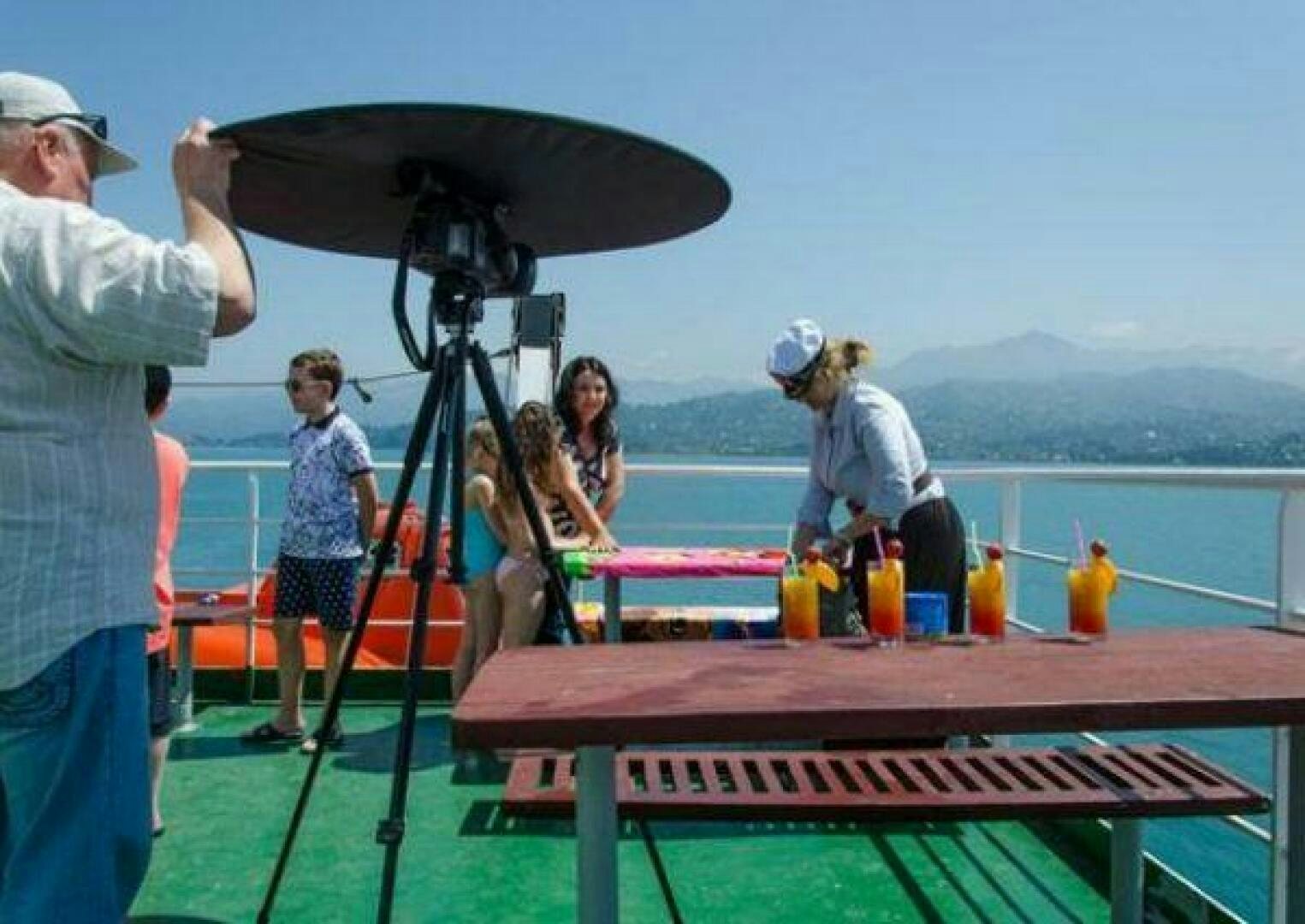 a group of people around a table aboard KAUNAS Yacht for Sale