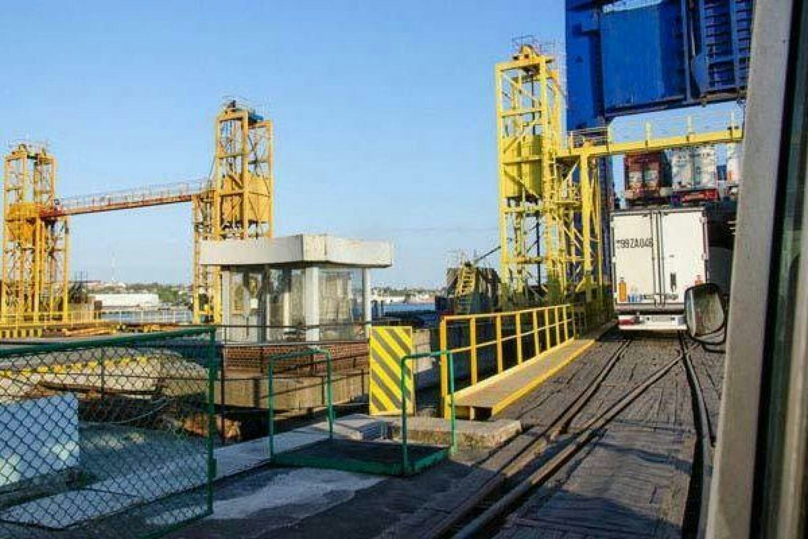 a factory with a yellow crane aboard KAUNAS Yacht for Sale