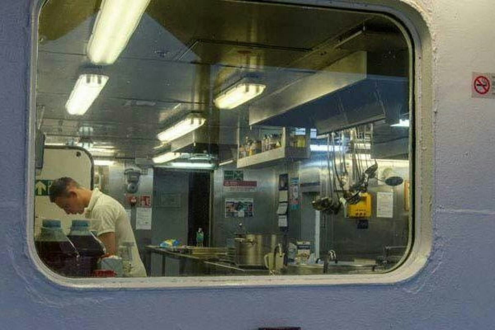 a man working in a machine aboard KAUNAS Yacht for Sale