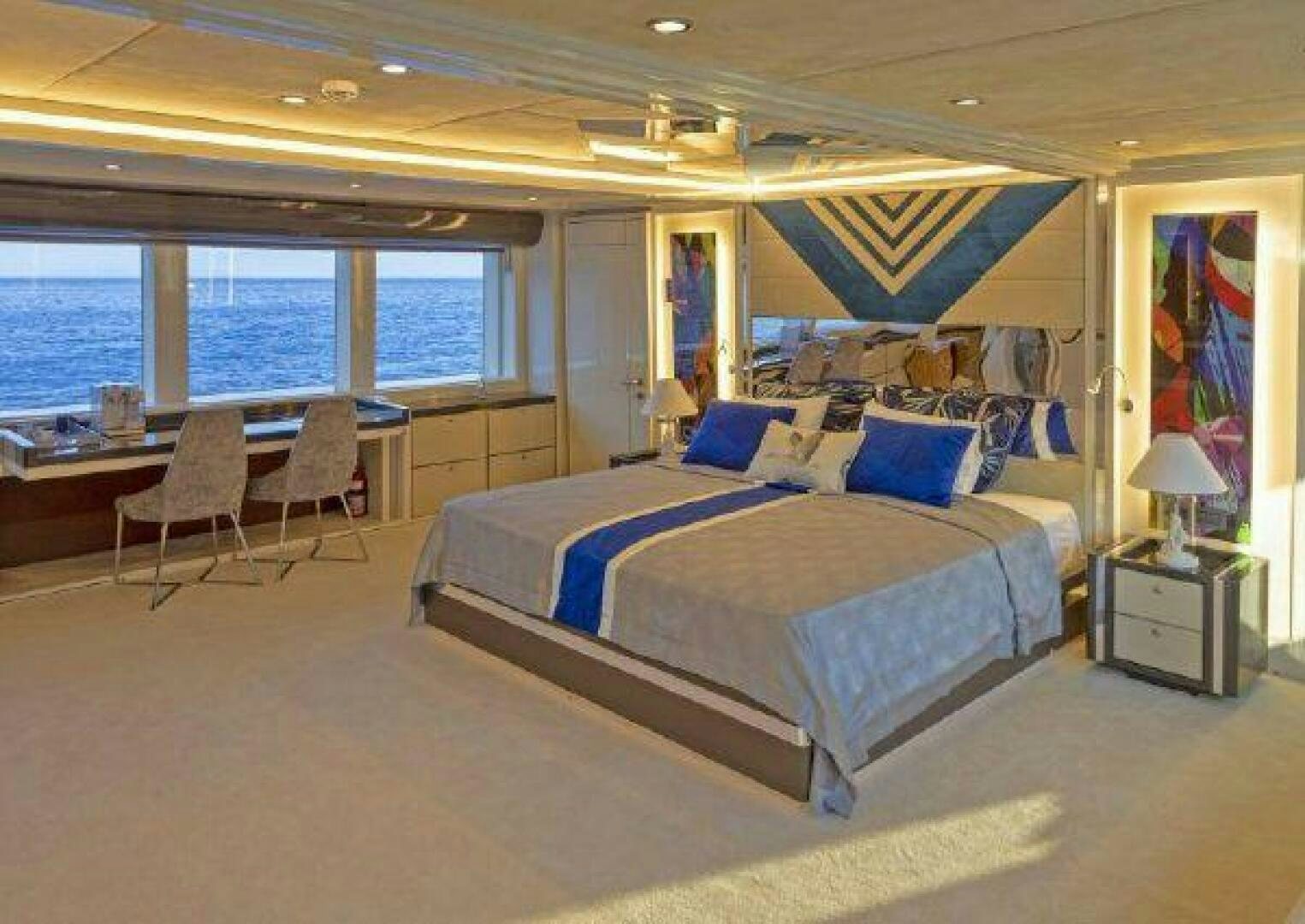 a large bedroom with a large bed aboard VETRO Yacht for Sale