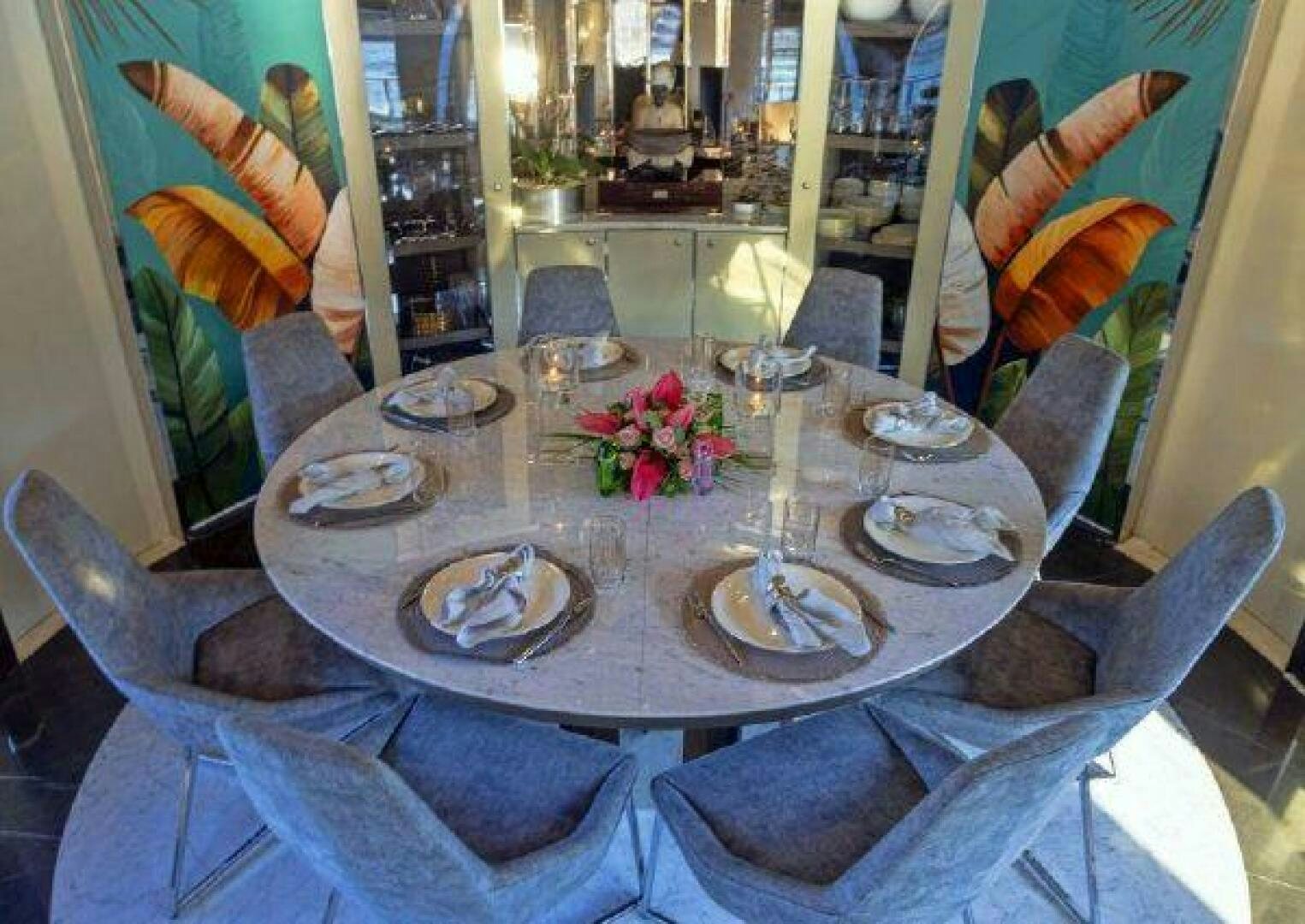 a table with plates and glasses aboard VETRO Yacht for Sale