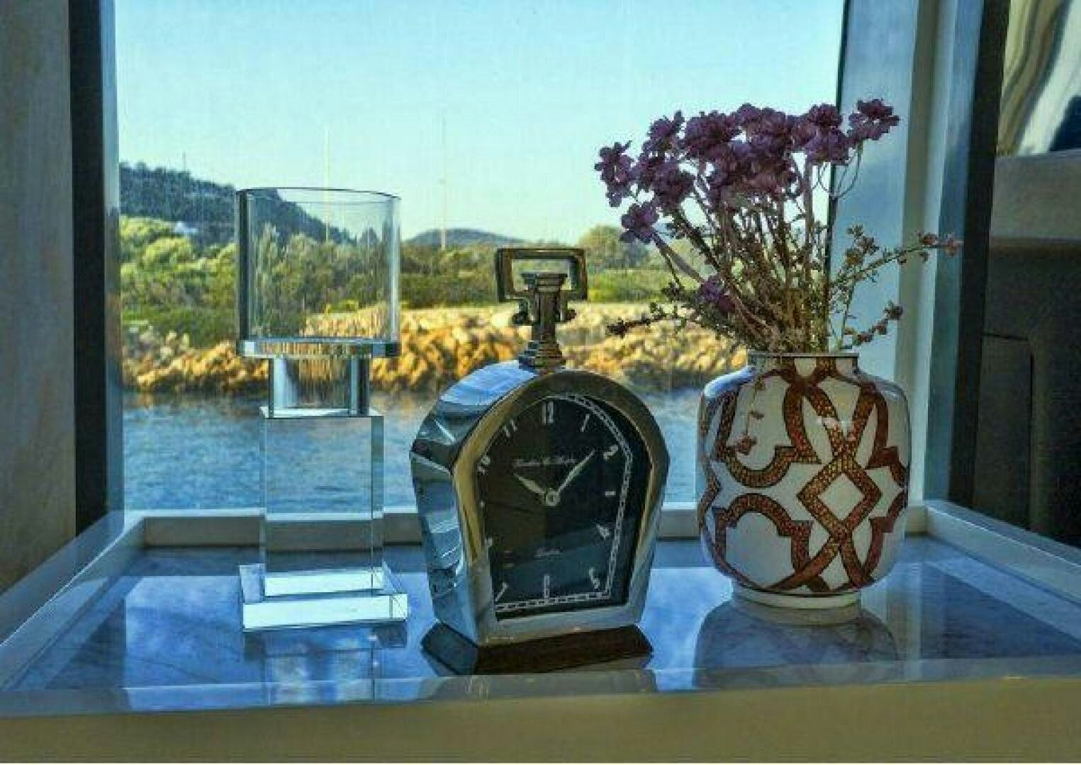 a vase and a candle on a table aboard VETRO Yacht for Sale