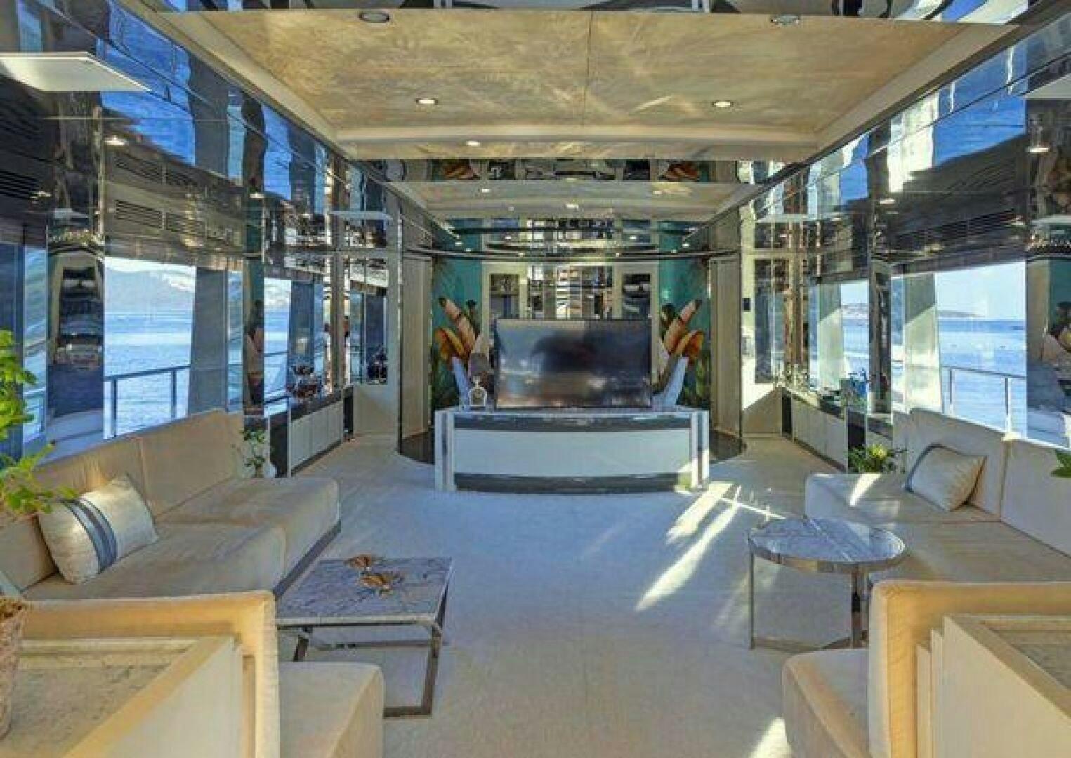 a room with a couch and a table aboard VETRO Yacht for Sale