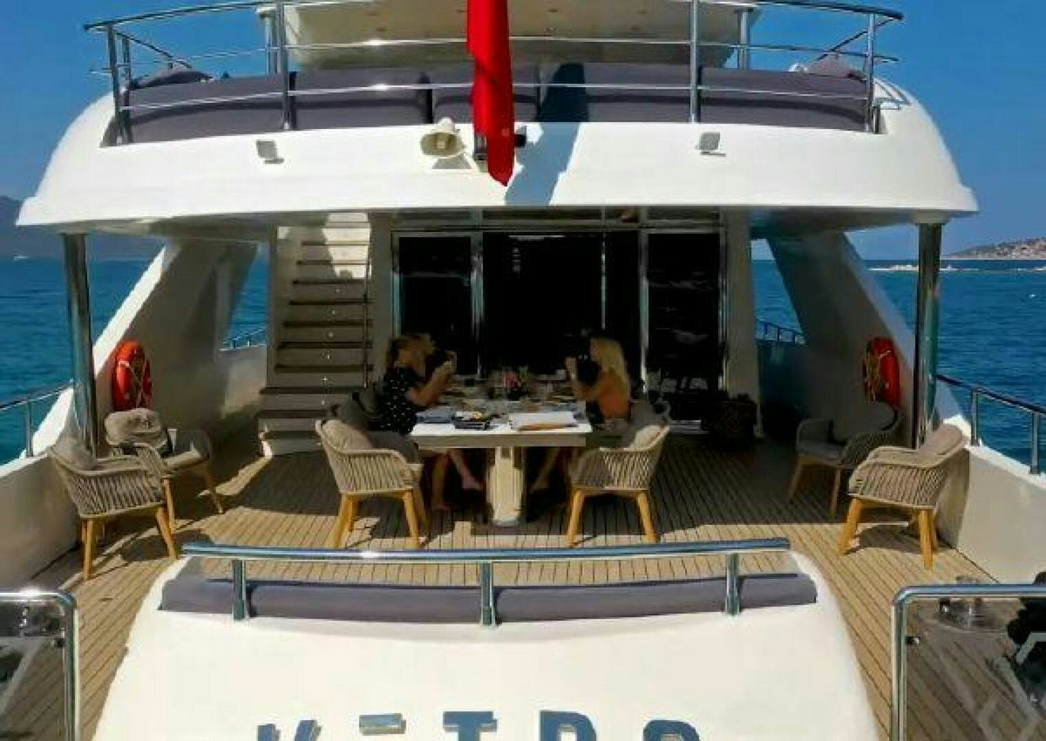 a boat with a table and chairs aboard VETRO Yacht for Sale