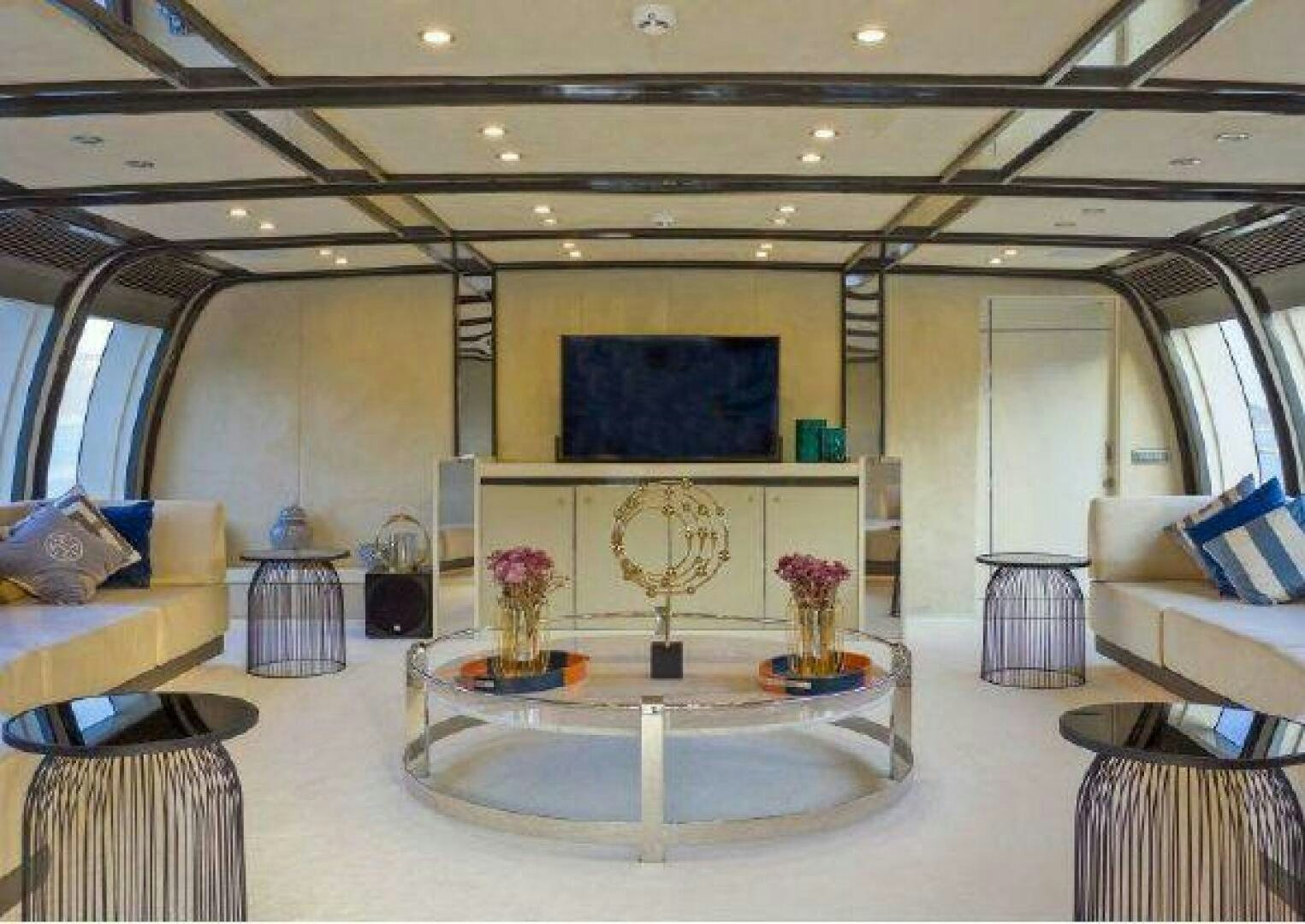 a large room with a table and chairs aboard VETRO Yacht for Sale