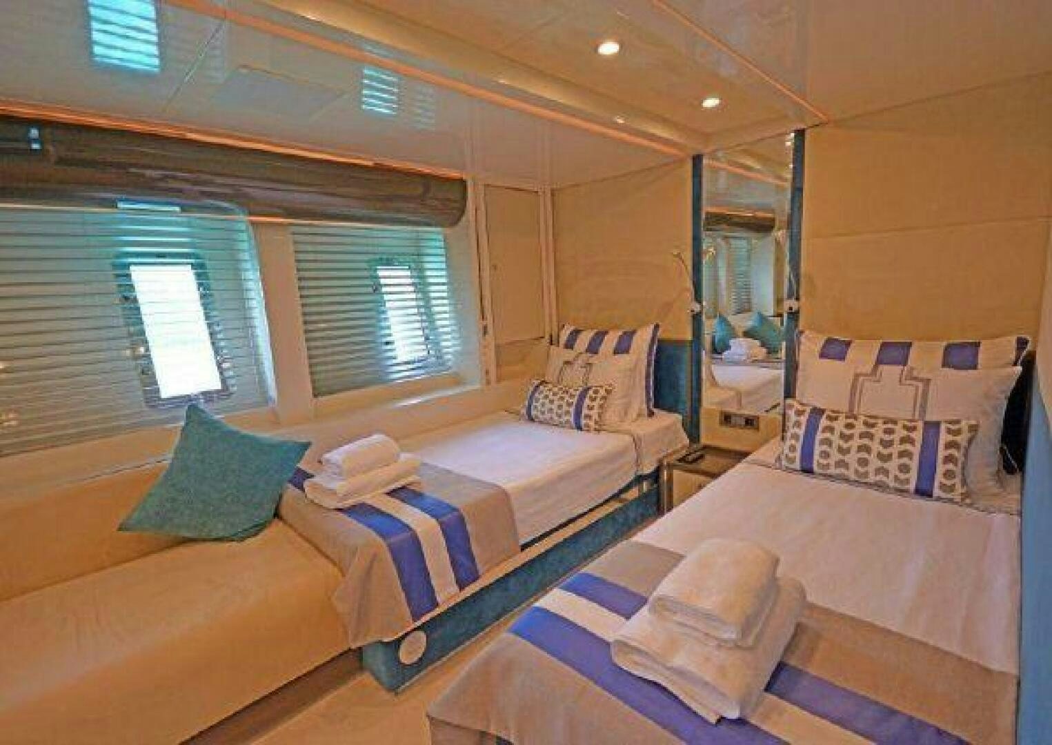 a couple of beds in a room aboard VETRO Yacht for Sale