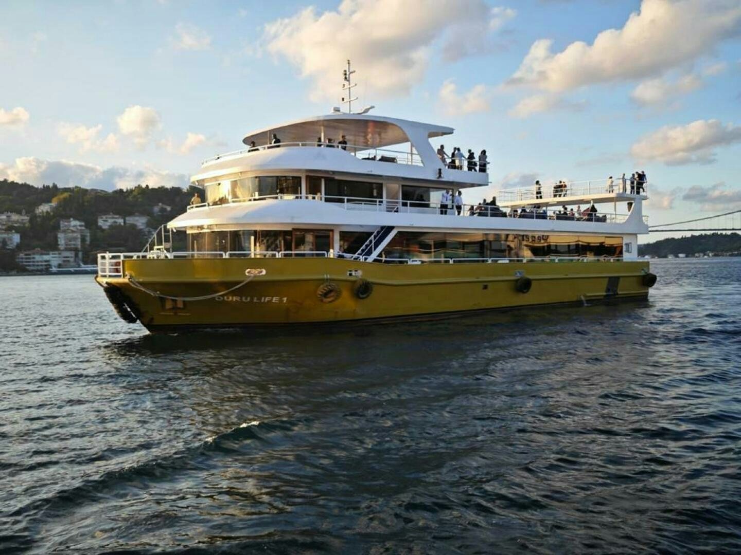 a yellow and white boat on water aboard DURU LIFE 1 Yacht for Sale