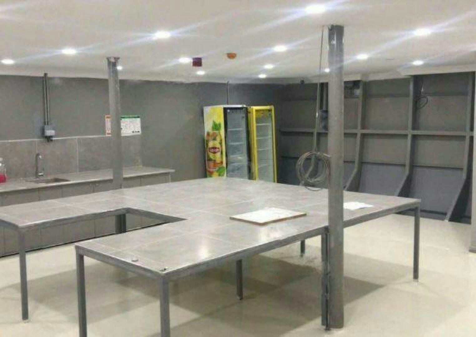 a large room with a table and a large metal bar aboard DURU LIFE 1 Yacht for Sale