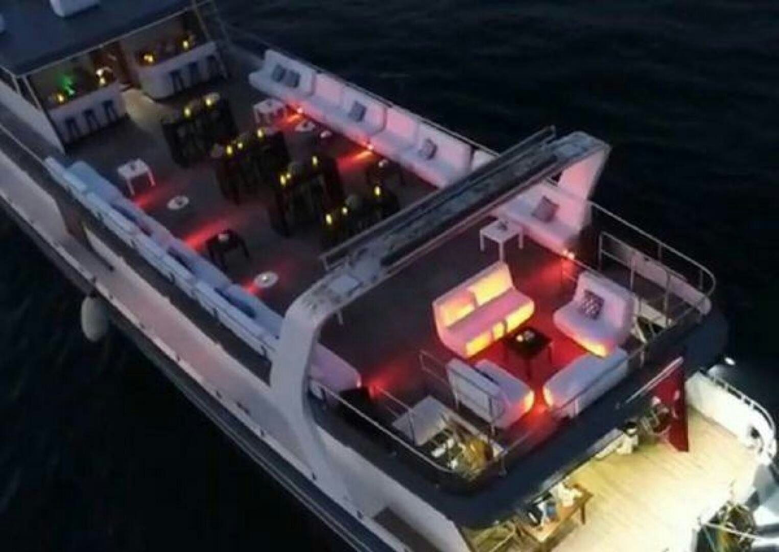 a large building with a lot of cars parked in it aboard BOSPHORUS PRINCESS Yacht for Sale