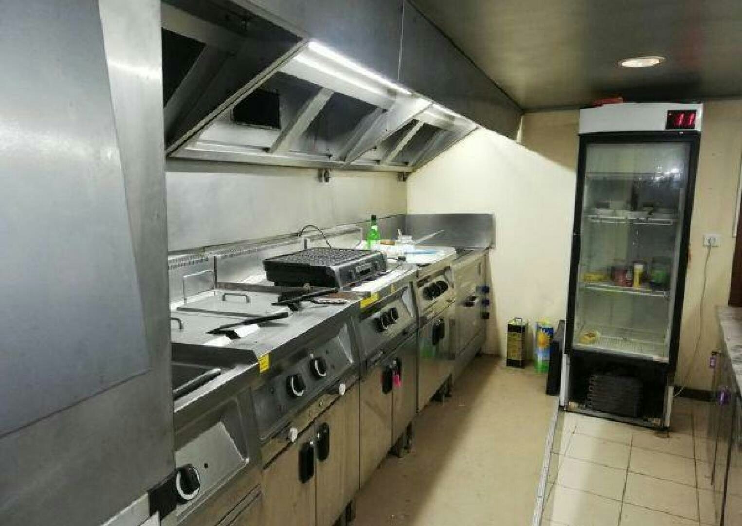 a kitchen with a fridge and oven aboard BOSPHORUS PRINCESS Yacht for Sale