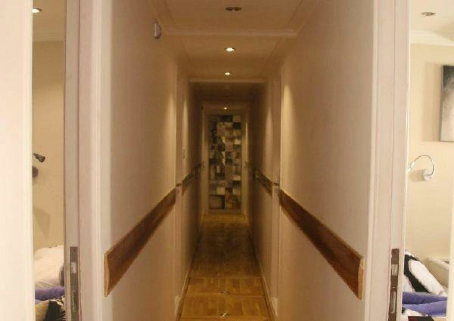 a hallway with a door aboard RED SEA QUEEN Yacht for Sale