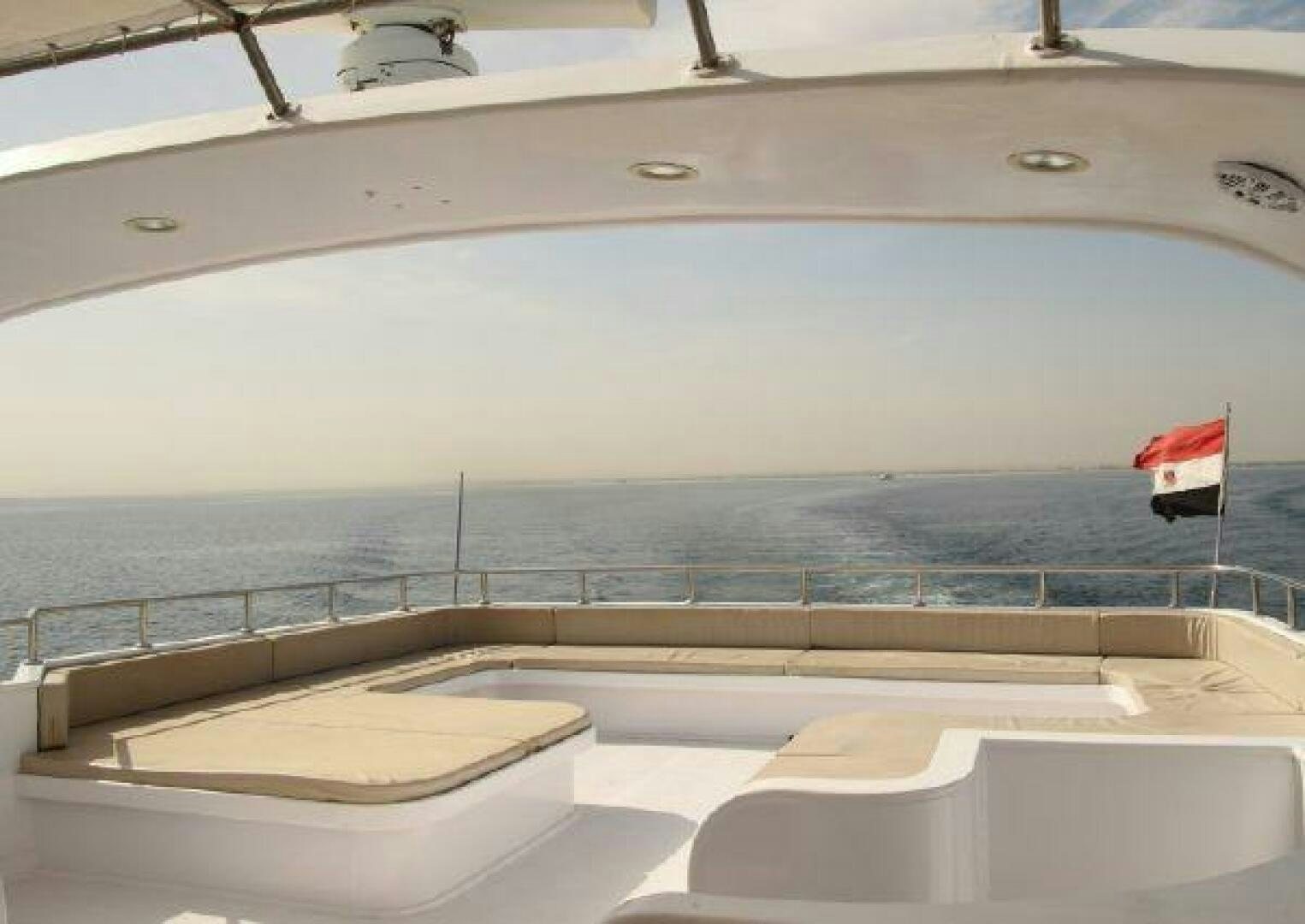 a view of a beach from a swimming pool aboard RED SEA QUEEN Yacht for Sale