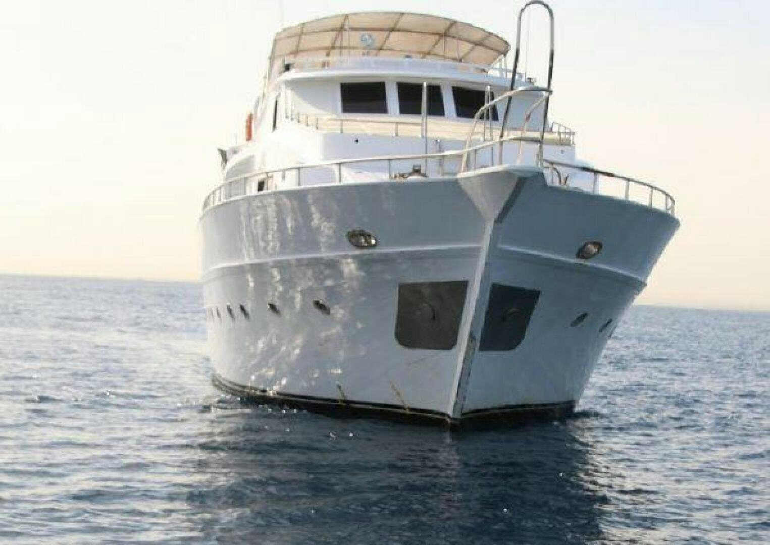 a white boat in the water aboard RED SEA QUEEN Yacht for Sale