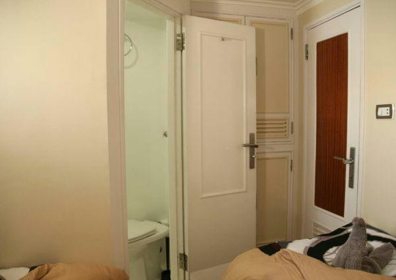 a room with a bed and a door aboard RED SEA QUEEN Yacht for Sale