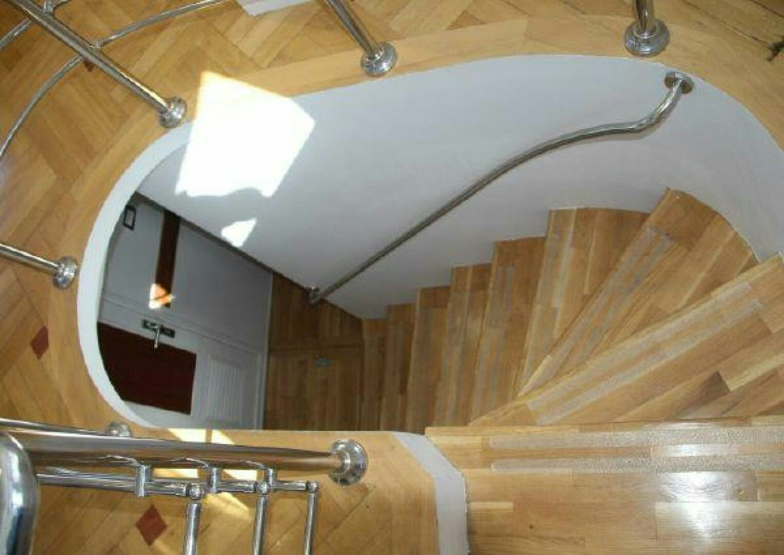 a wooden table with a white table and chairs aboard RED SEA QUEEN Yacht for Sale