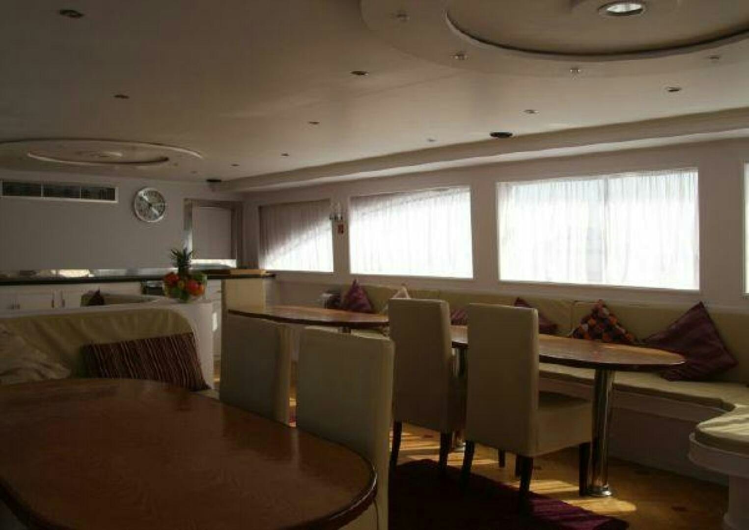 a room with a table and chairs aboard RED SEA QUEEN Yacht for Sale