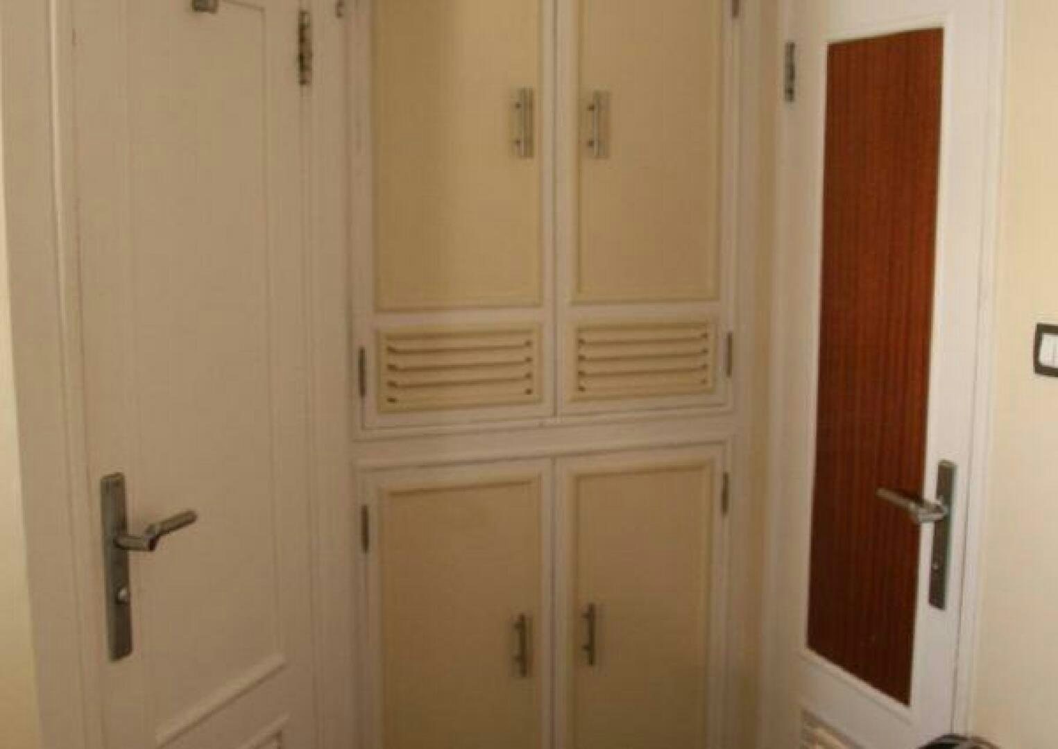 a white door with a handle aboard RED SEA QUEEN Yacht for Sale