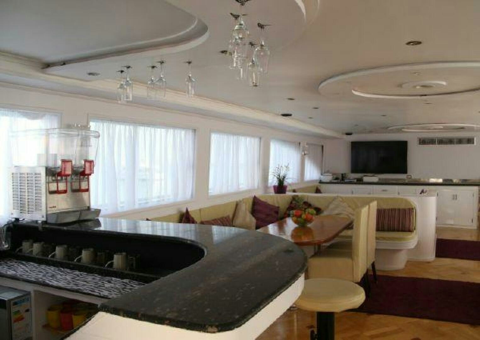 a kitchen with a black counter top aboard RED SEA QUEEN Yacht for Sale