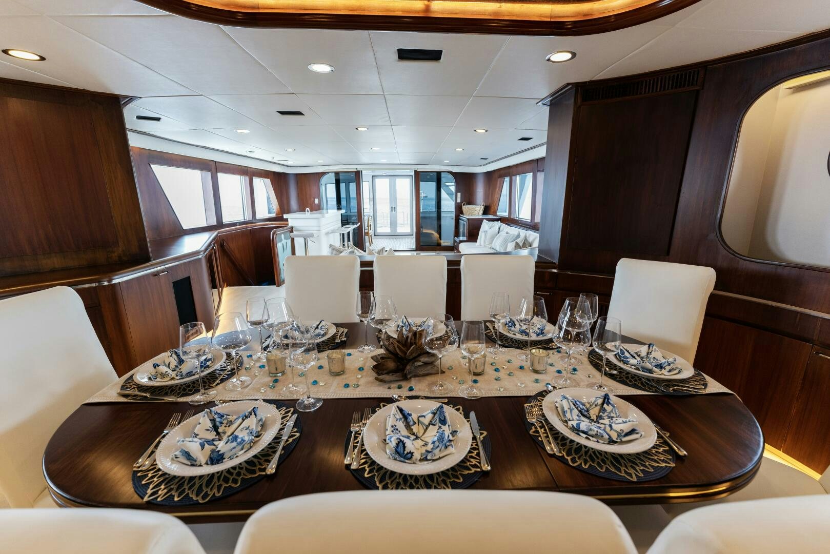a large dining room with a large table set for a meal aboard ARIES Yacht for Sale