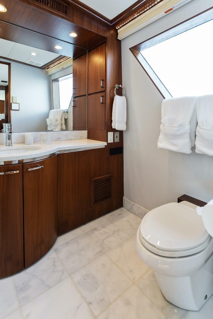 a bathroom with a toilet and a sink aboard ARIES Yacht for Sale