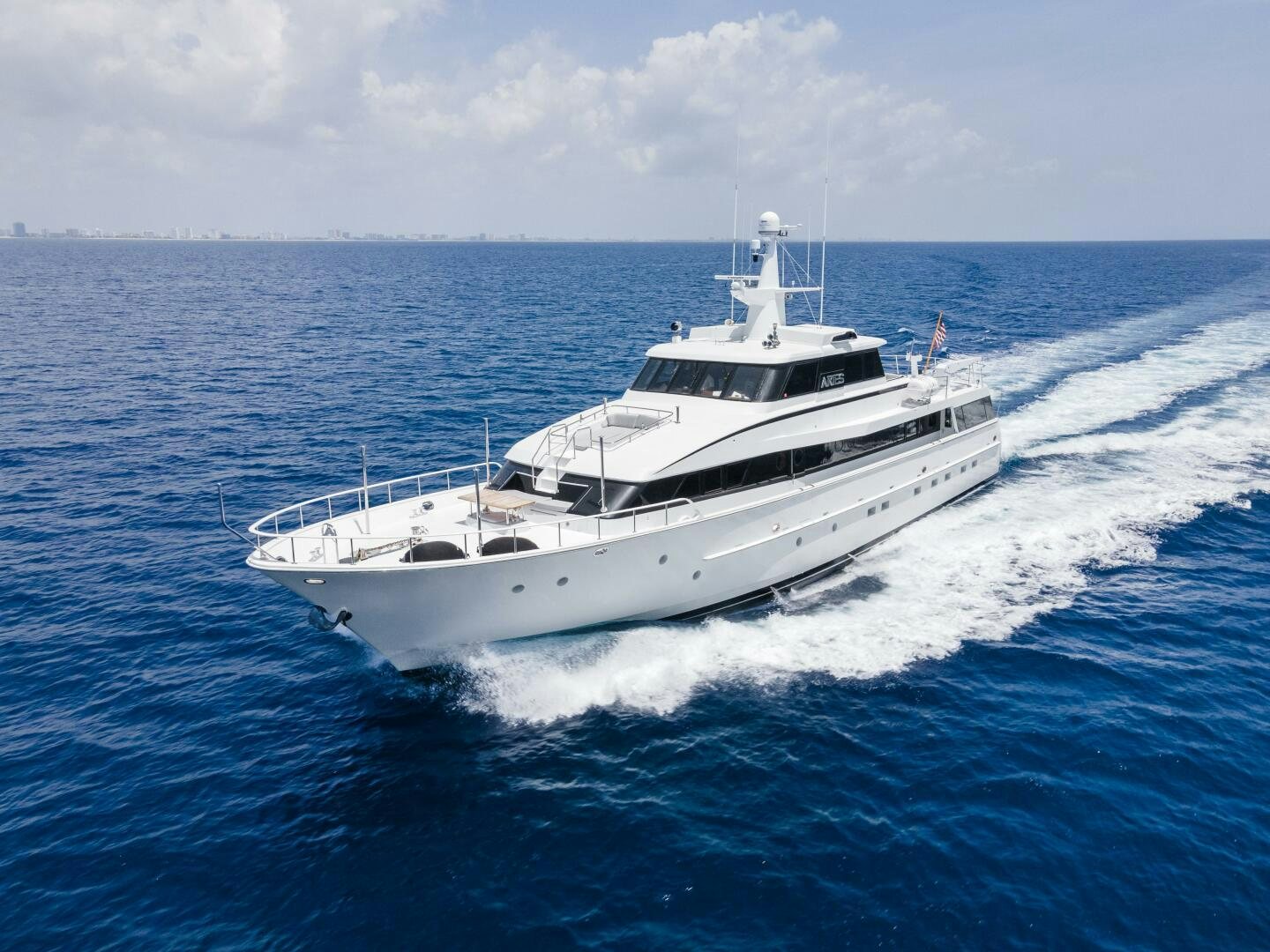 a white boat on the water aboard ARIES Yacht for Sale