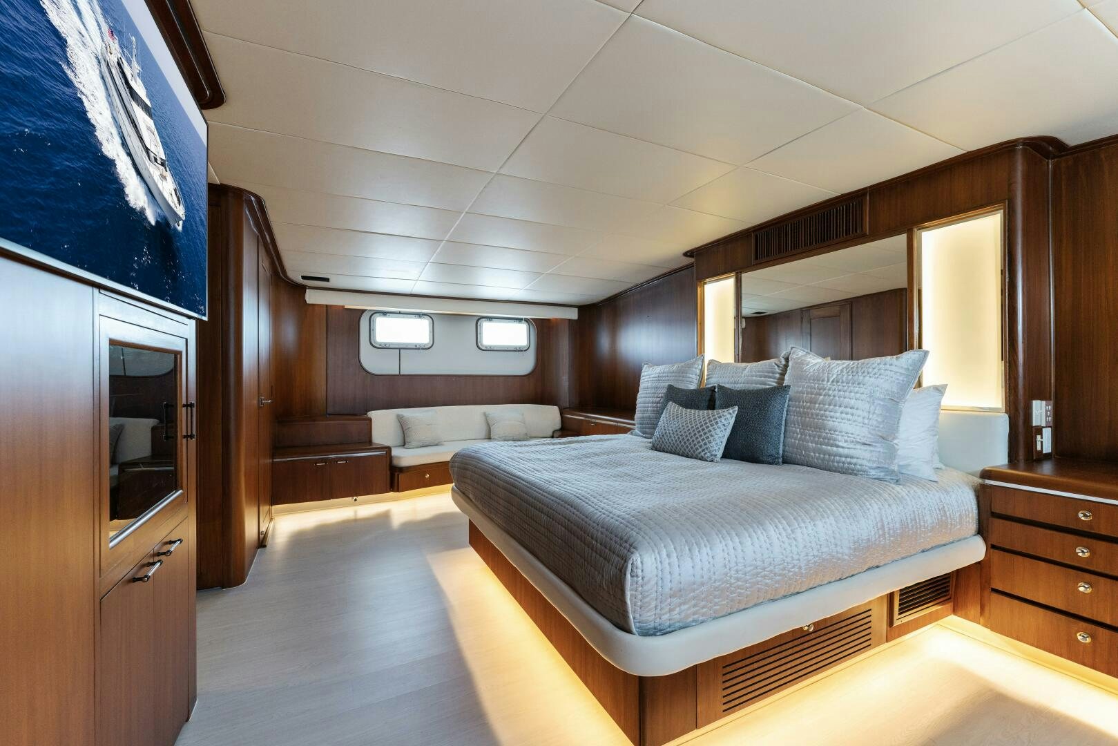 a room with a bed and a television aboard ARIES Yacht for Sale