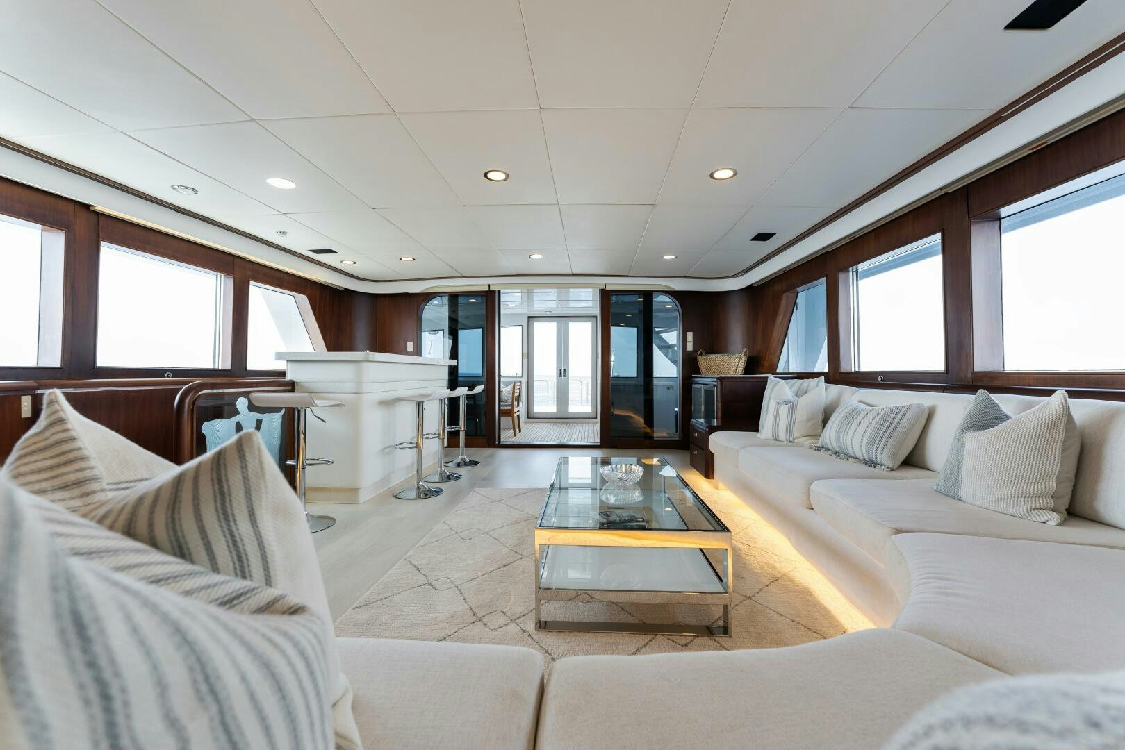a living room with a couch and a table aboard ARIES Yacht for Sale