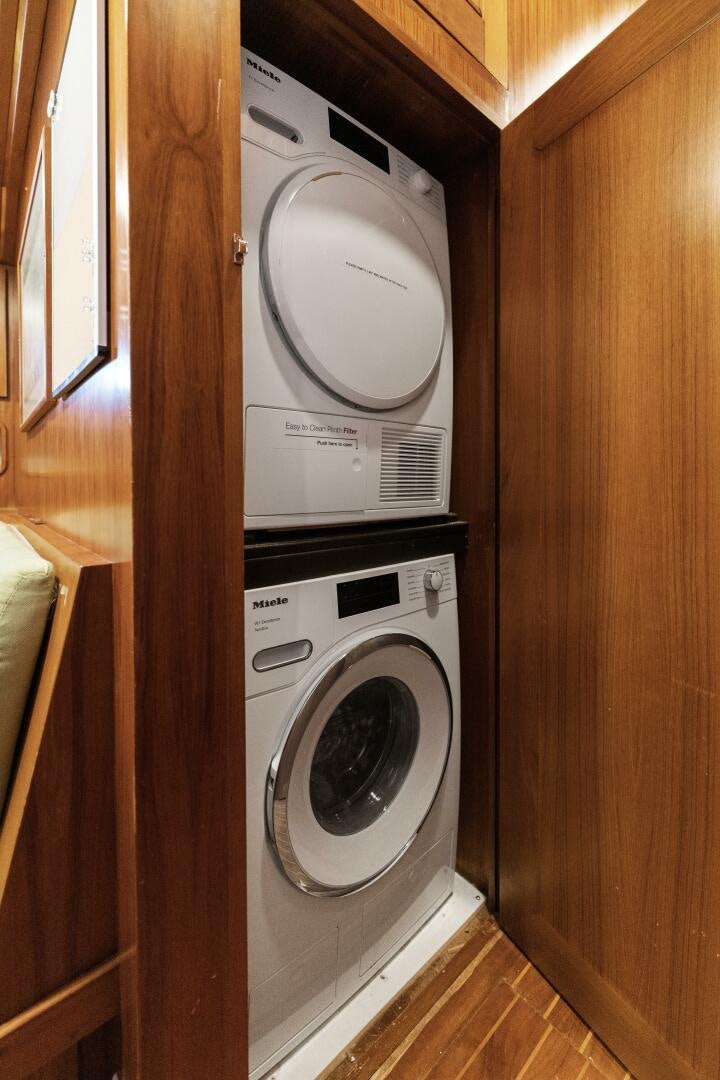 a white washing machine aboard ARIES Yacht for Sale