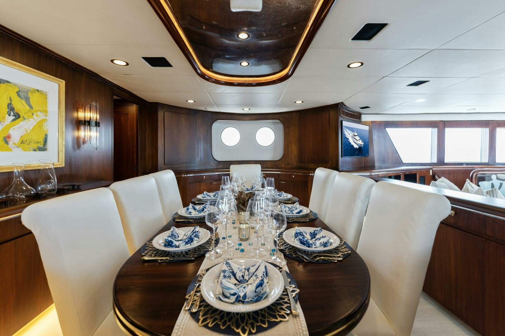 a dining room with a table aboard ARIES Yacht for Sale