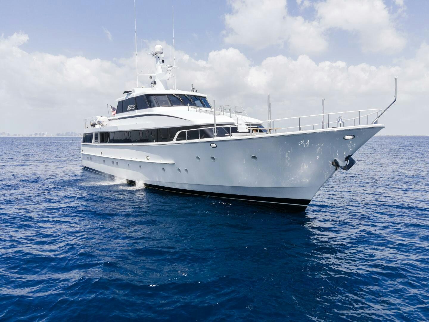 a white yacht in the water aboard ARIES Yacht for Sale